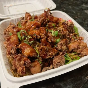 Fried noodles with garlic chicken ($23) - mix veggies, sesame soy, fish cake, green onions, crispy onions