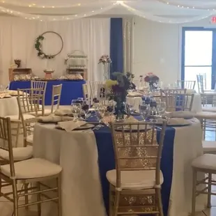 Beautiful table settings and candy bar in the back.