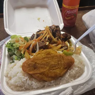 Fried turkey meal plate. The dish came with rice and beans, plantains, and a side salad. Not pictured is the delicious akra dish I ordered