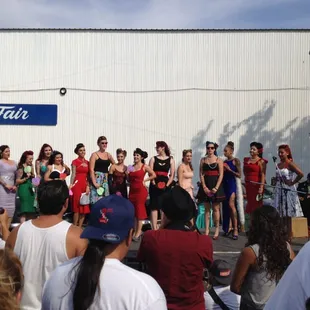 a group of people standing in front of a building