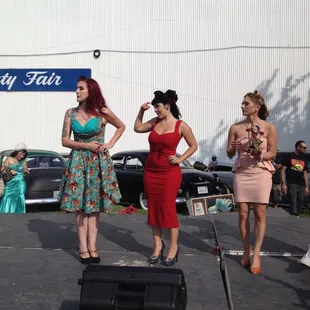 a group of women standing on a stage