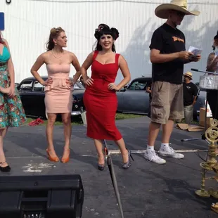 a group of women in dresses