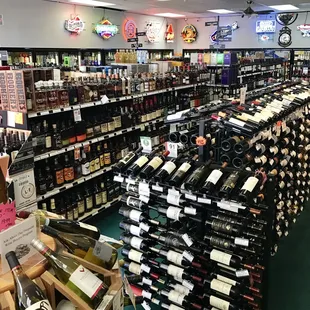 rows of wine bottles in a liquor store