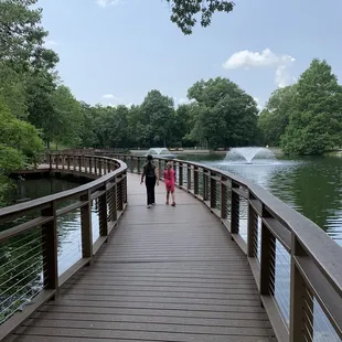 A bridge going around the pond
