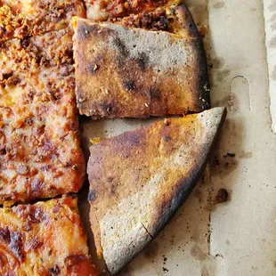 a half eaten pizza in a box
