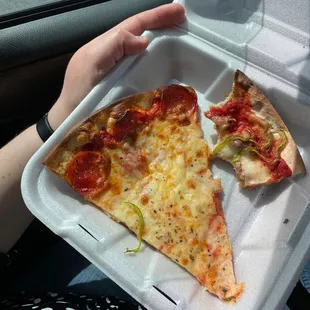 2 pieces of pizza and a pop for $6!