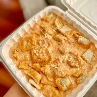 Huge portion of chicken ravioli with tomato basil