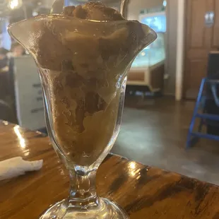 Warm apple pudding cake served in a glass