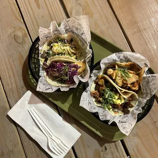 Tacos of fish, pork, and potato with poblano sauce.