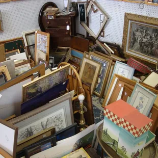 This vendor has a lot of vintage and antique framed items.