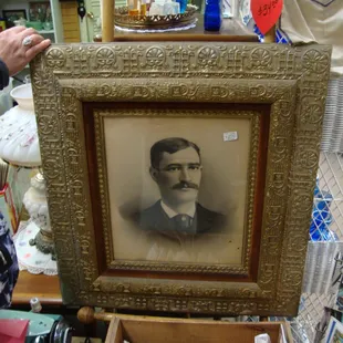 A large ornate turn-of-the-century frame.