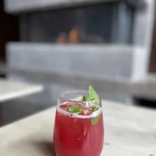 a drink in a glass on a table