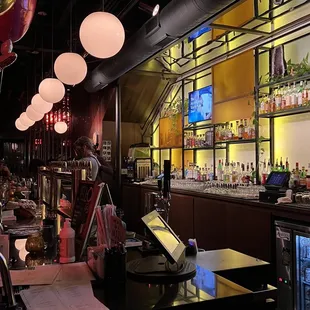 a bar with lots of bottles
