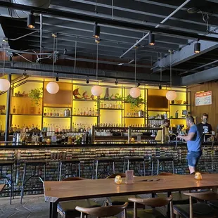 people standing at a bar