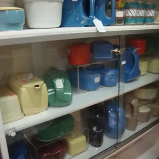 A big collection of ceramic refrigerator storage containers from the 40s and 50s - cool!