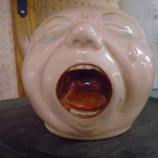A funny and somewhat creepy antique ceramic mug!