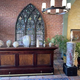 Ceramics on display in the entryway of the space.