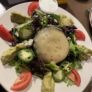 Huge salad topped with local Diamond beef pattie covered in pepper jack....