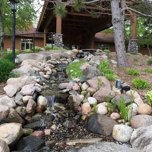 a waterfall in front of a restaurant