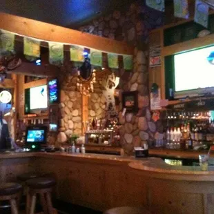 a bar with a stone wall