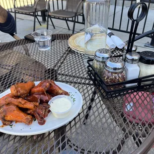 Wings - half Buffalo, half bbq. Saucy, tender, crisp. Cute patio table too.