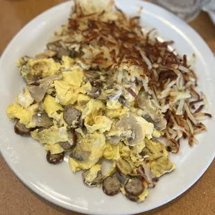 Custom scramble with turkey sausage, mushrooms and goat cheese served with crispy hash browns and sourdough toast.