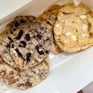 Chocolate honeycomb, cookies &apos;n cream, oatmeal chip w/ pecans, and white chocolate macadamia (cookies &apos;n cream one is a must-have!)