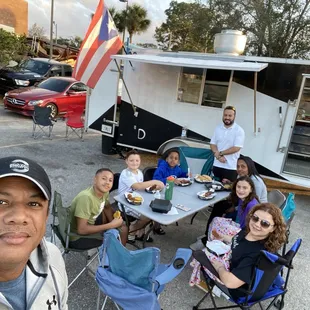 a group of people sitting around a table