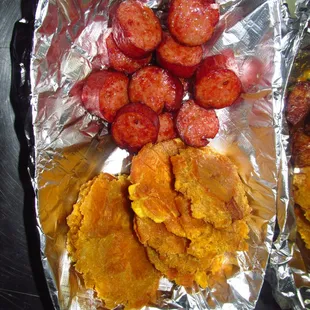 Fried plantain and fried smoked sausage.