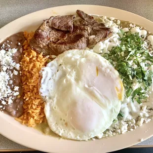 Steak chilaquiles with over easy eggs