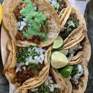 Stake and acecina tacos with cilantro and onion, hubby put green salads in one of them before I took the pic! Lol