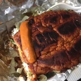 Pambazo,fillings are potatoes with chorizo, shredded lettuce , Queso fresco and crema.