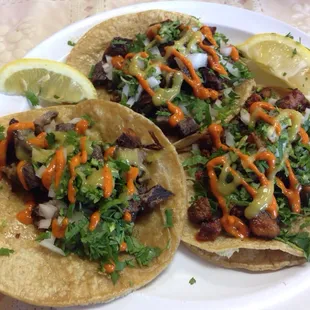 Two tacos if Brain and two one taco seasoned pork and pineapple exotic huh