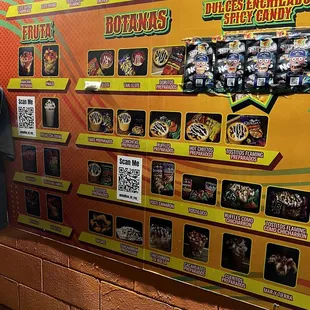 a man standing in front of a display of food