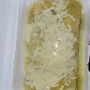 an enchiladada in a styrofoam container