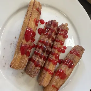 Churros with a cherry sauce