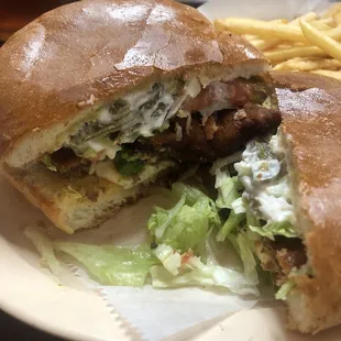 Milanesa steak torta with everything on it! So delicious