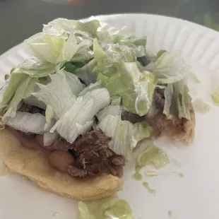 a taco on a paper plate