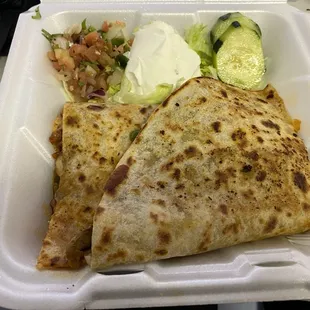 a meal in a styrofoam container
