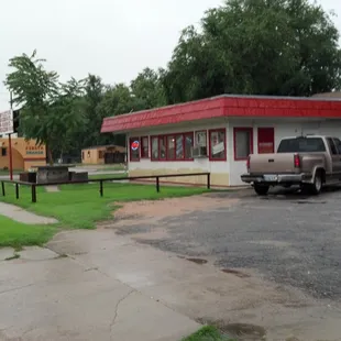 a car parked in front of a restaurant