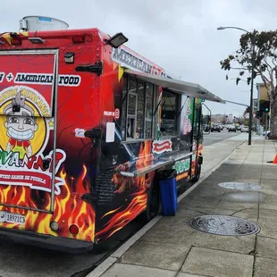 a mexican food truck on a city street