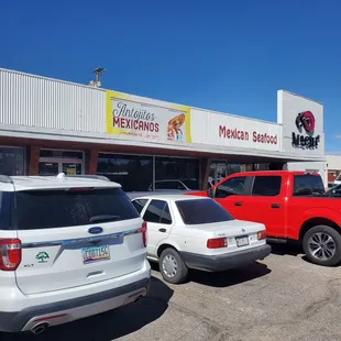 cars parked in front of a mexican restaurant