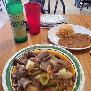 a plate of beef and rice