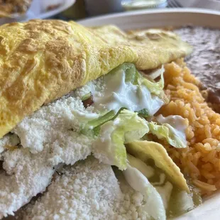 chilaquiles green with scrambled eggs rice and beans