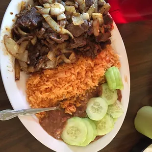 Steak and onion $13 I added cucumbers myself from their tray, comes with tortillas too