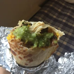 Asada burrito (with a bite). Pretty dry (better with the green sauce)