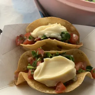 two tacos with cheese