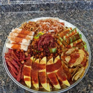 Sandia Loca: Sandila, mango, jicama, peanuts, tamarindo candys, banderilla, chamoy, tajin, limon