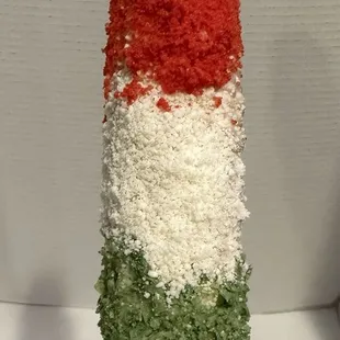 Elote bandera with hot Cheetos and green takis