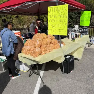 a table of pastries for sale
